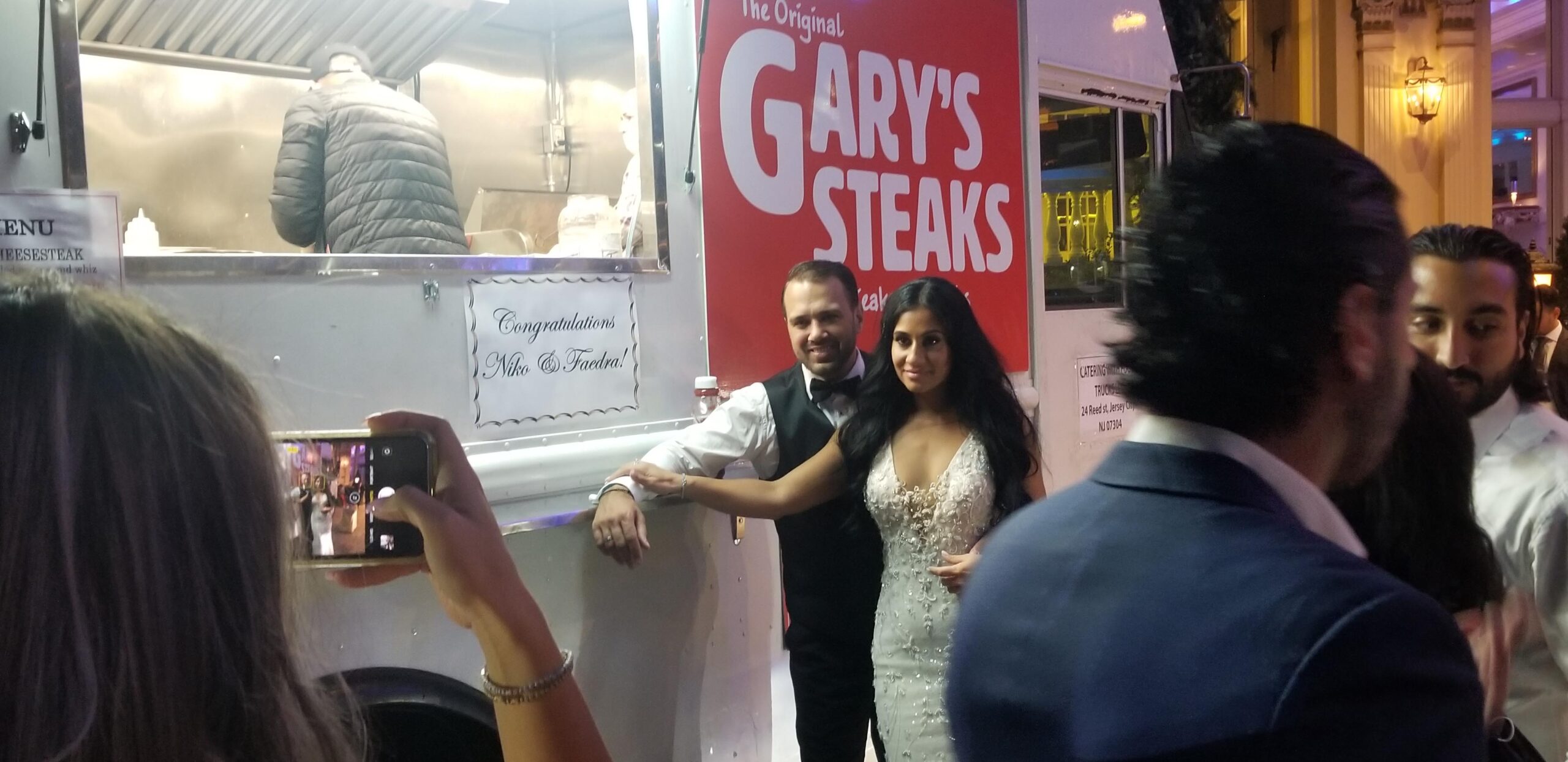 bride and groom at wedding food truck garyssteak